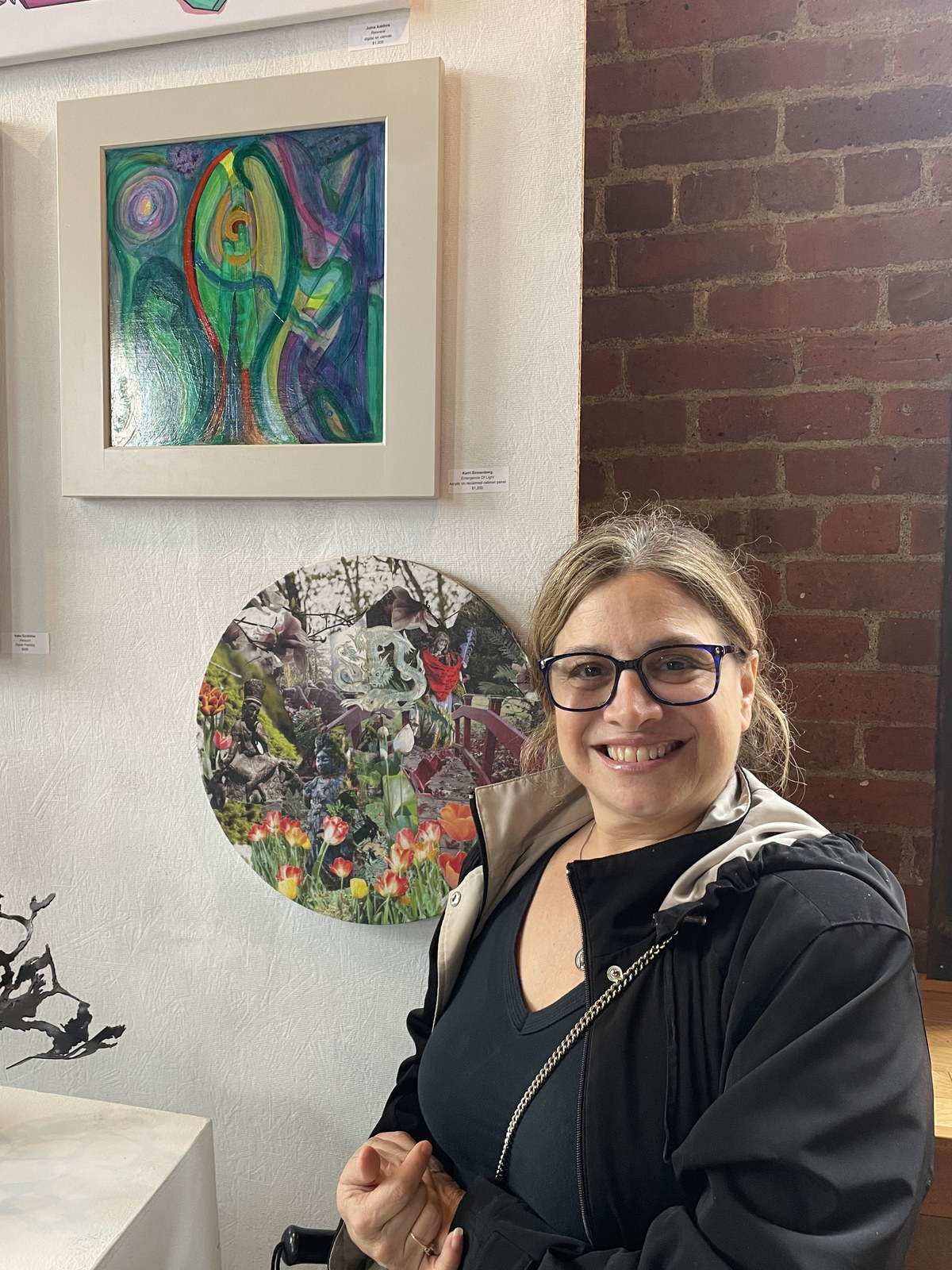 Kerri Sinnenberg standing beside her painting Emergence of Light at the Albany Center Gallery Summer Art Fest